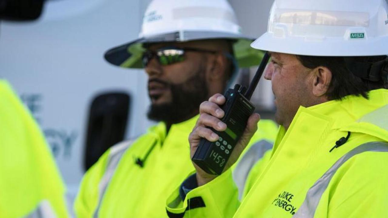 People in hard hats and reflective jackets