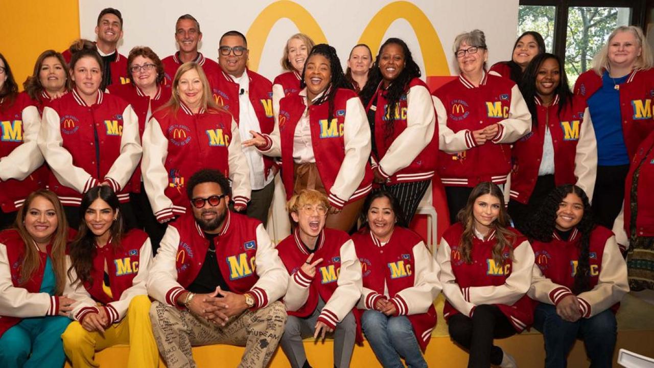 Group together wearing McDonald's letter jackets
