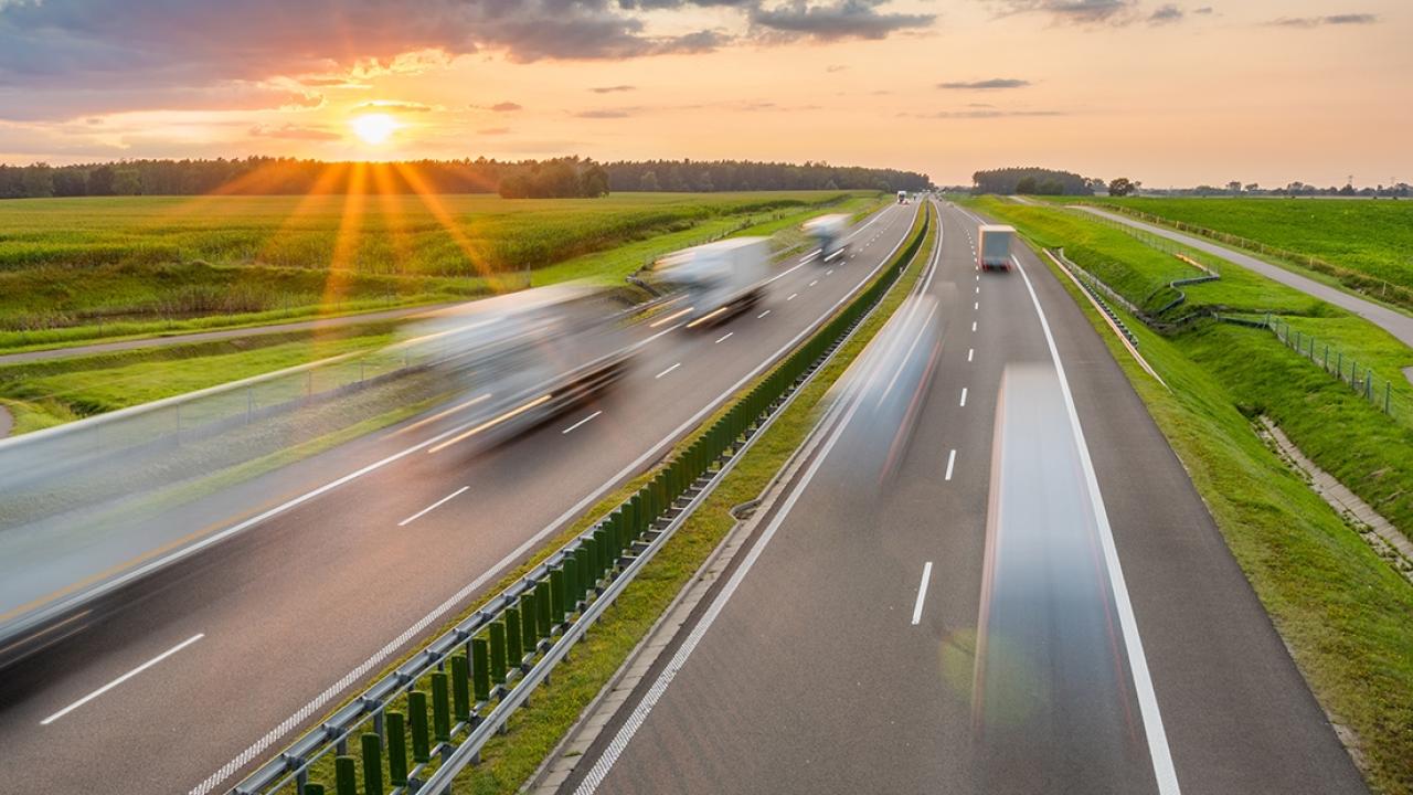 vehicles driving down a highway