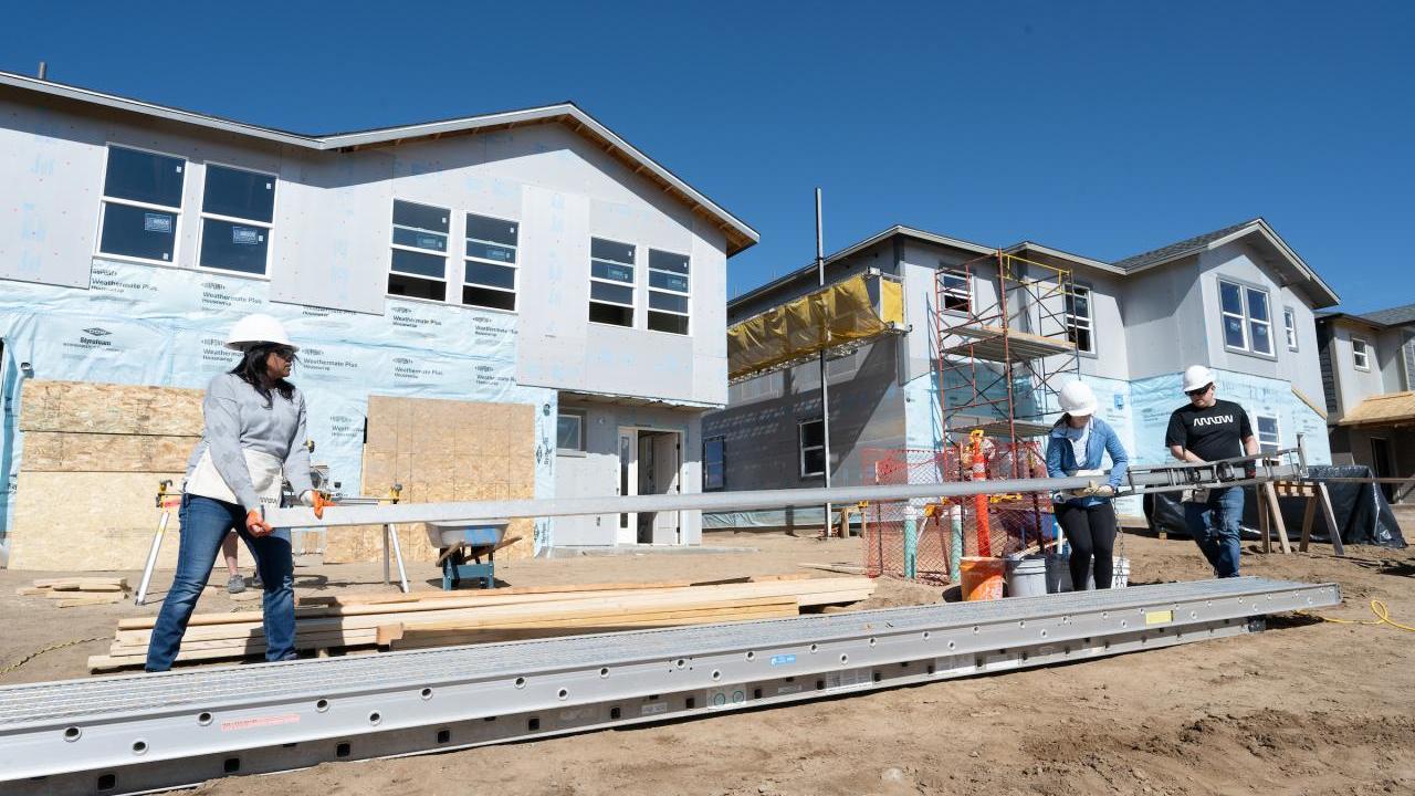 People working on house construction