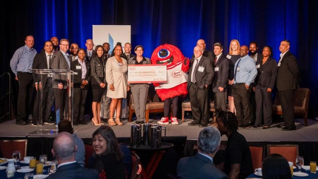 Group of people holding a check