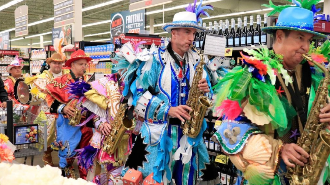 People dressed up for Italian-Heritage Month playing instruments