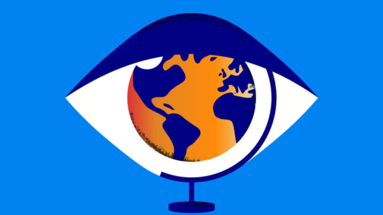 Digital art, a desk globe positioned to appear as the pupil of an eye on a blue background.