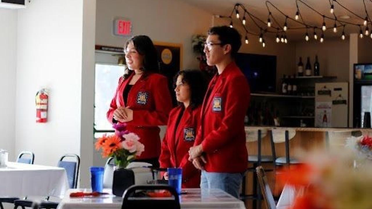 A group of people standing in a room