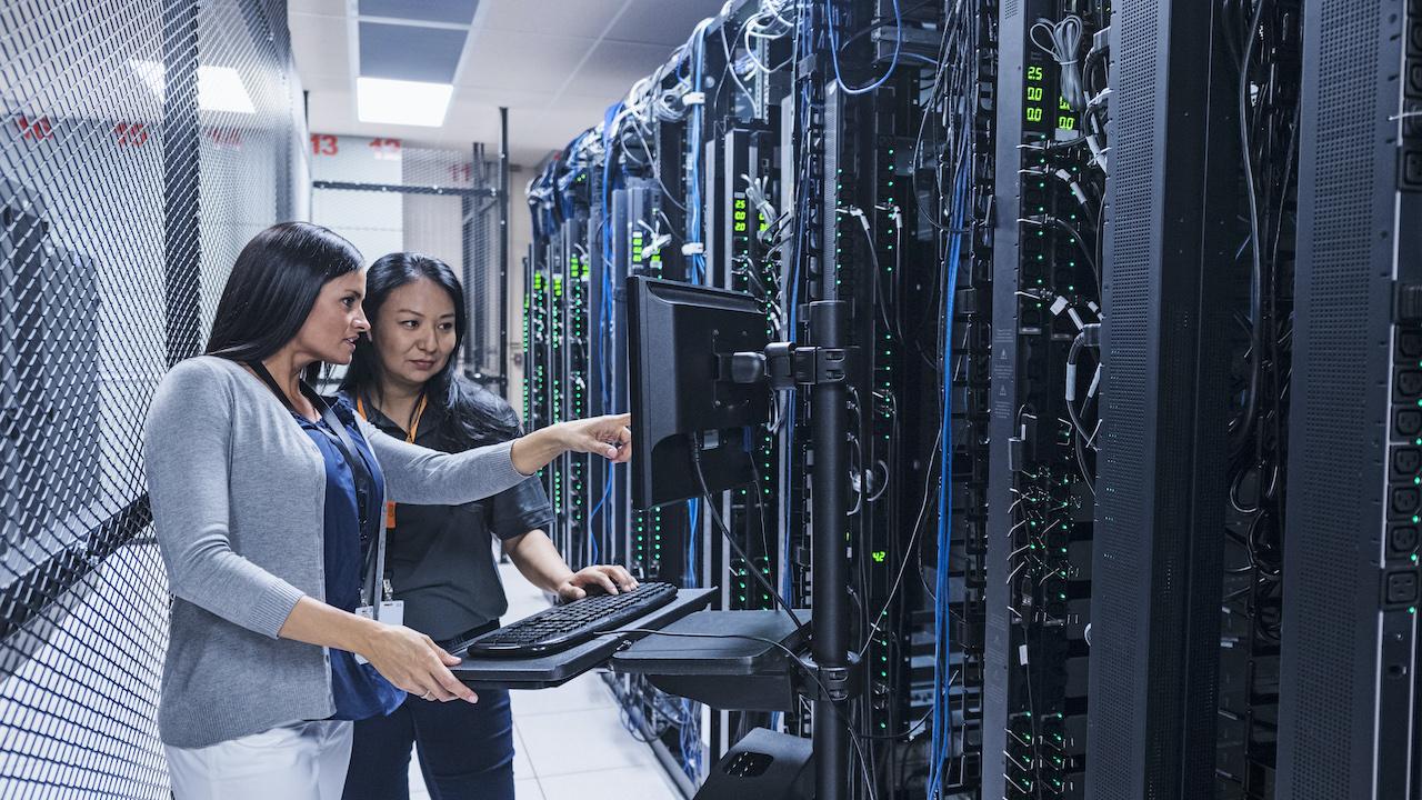 Women working in front of computer servers