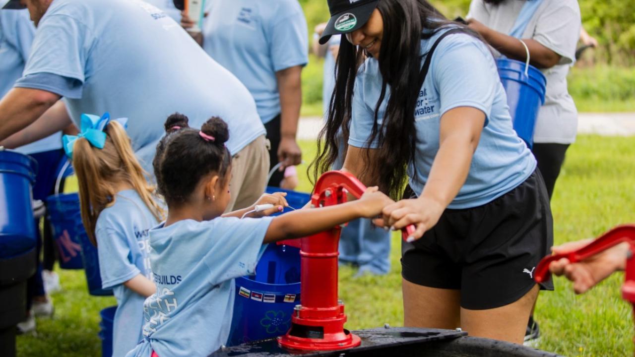 Pumping water at Walk for Water