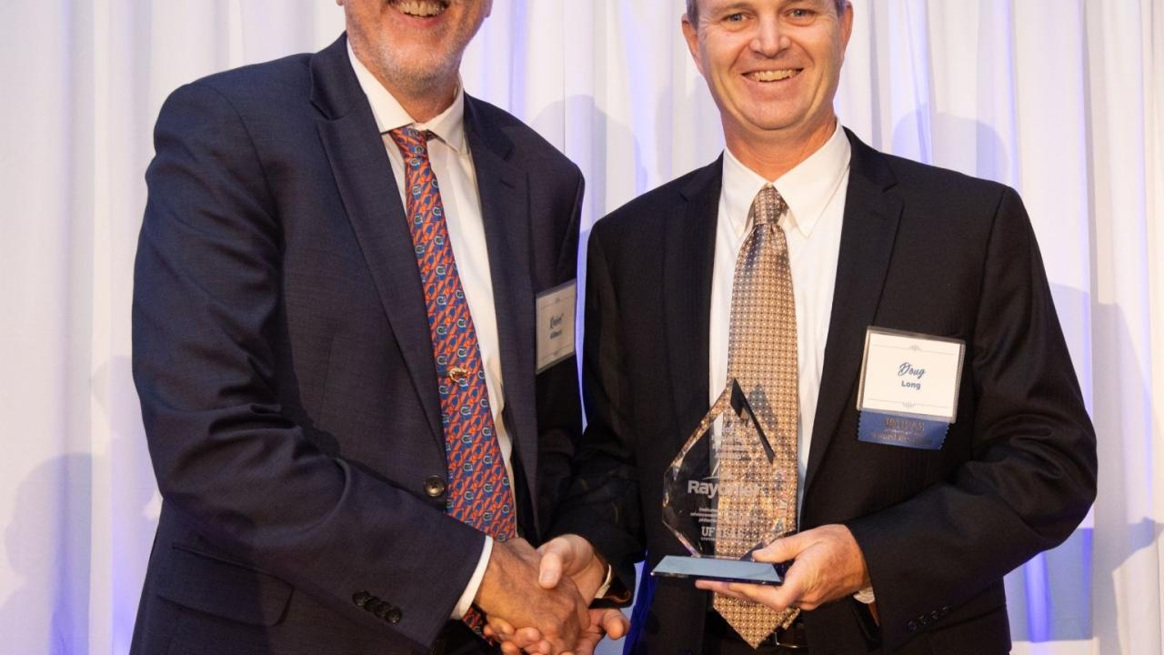 Senior Vice President Doug Long, a UF graduate, received the award on Rayonier's behalf.