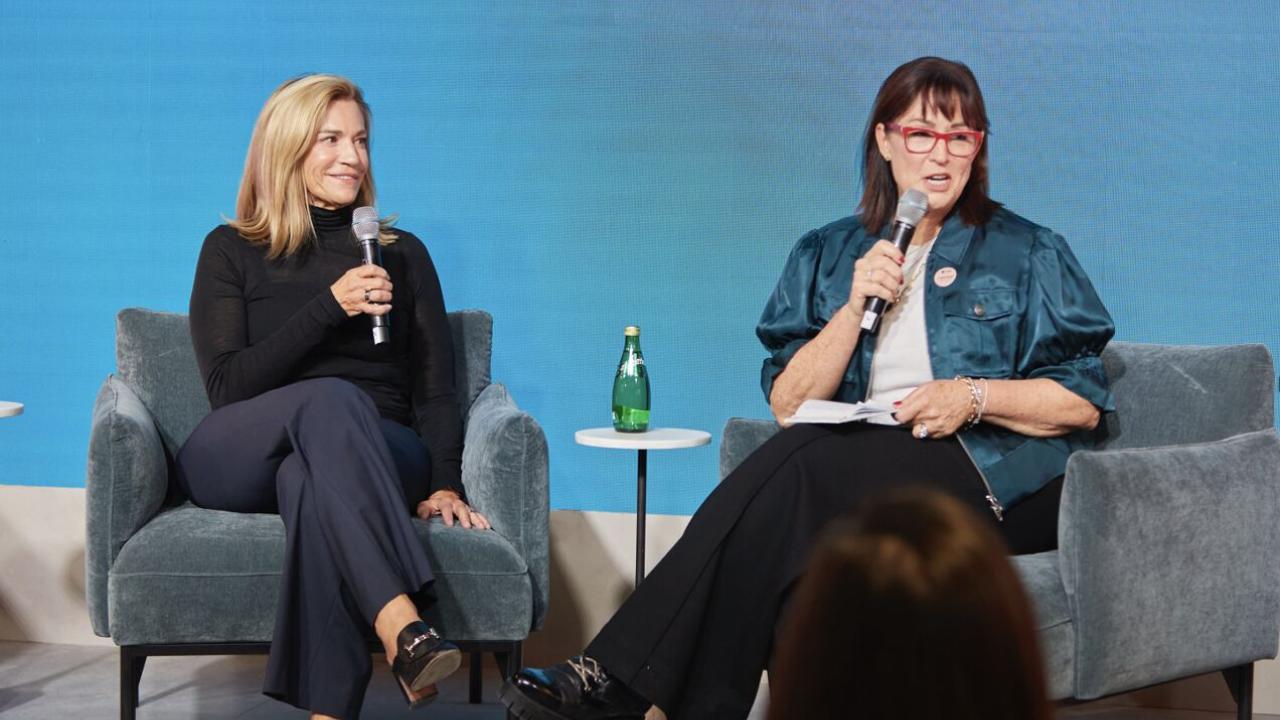 Laura Kohler and Kimberley Seldon sitting in armchairs with microphones
