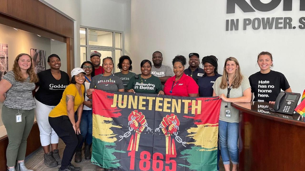 group with Juneteeth flag