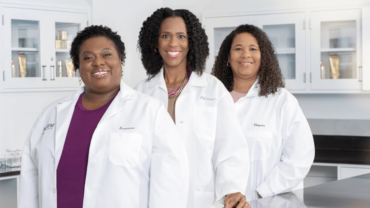 Three people in lab coats