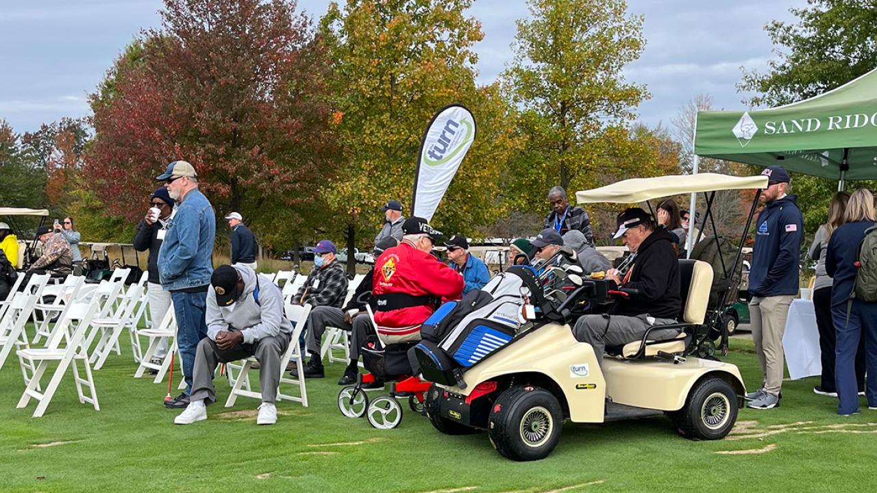 Participants, volunteers, and caregivers at the 2023 Stars, Stripes, and Links Event at Sand Ridge Golf Club in Chardon, Ohio.