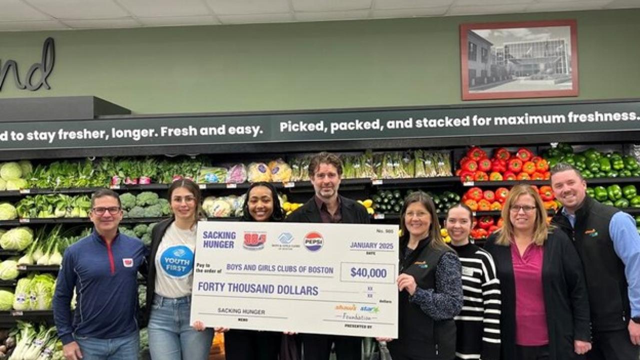 Group of people posing with check for $40,000