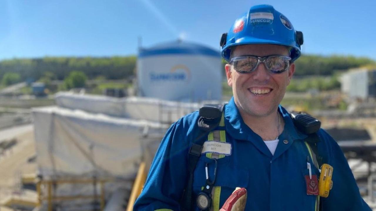 Michael Vickers in suncor uniform and safety gear.