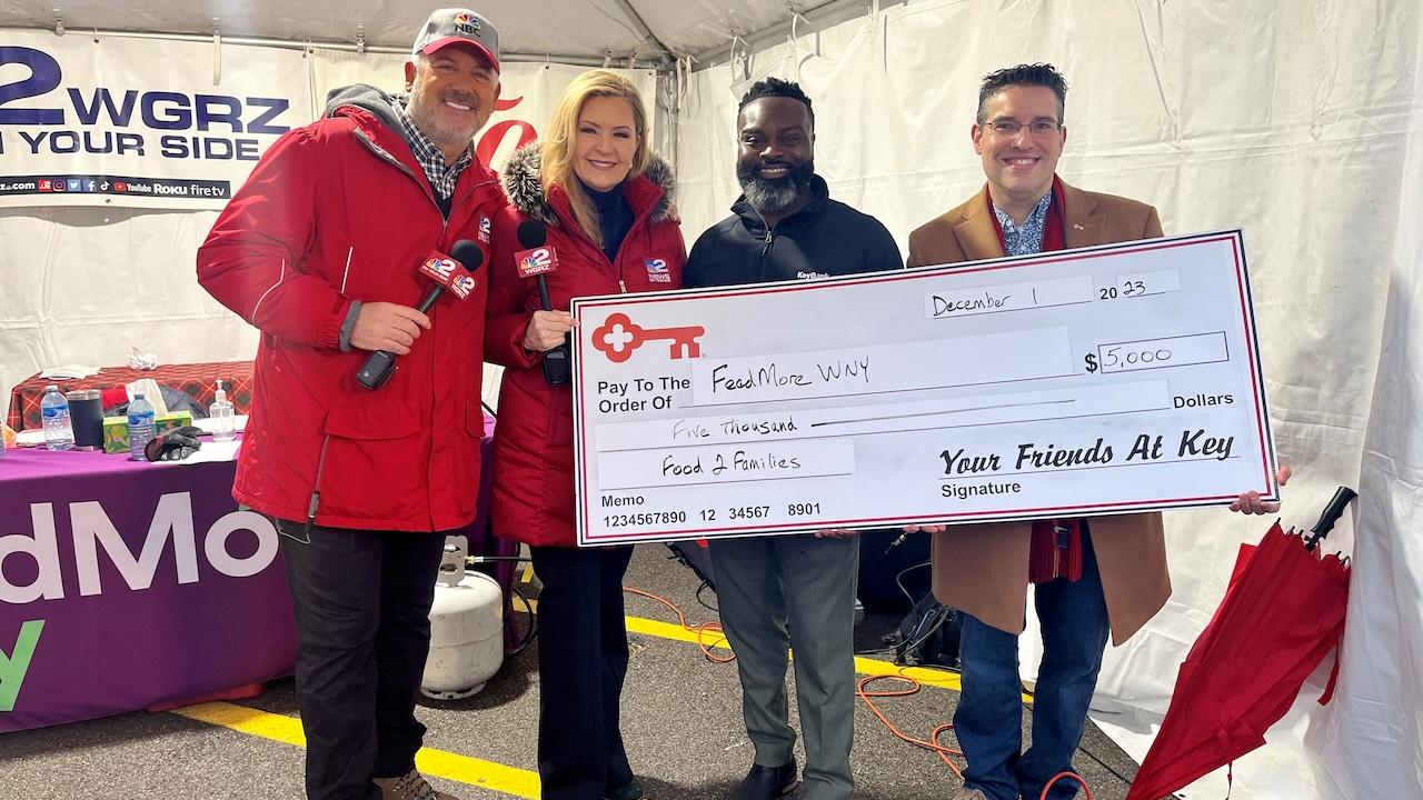 KeyBank representatives presenting a check for $5000. to Food 2 Families campaign.