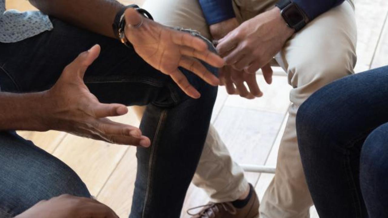 group of hands at a meeting