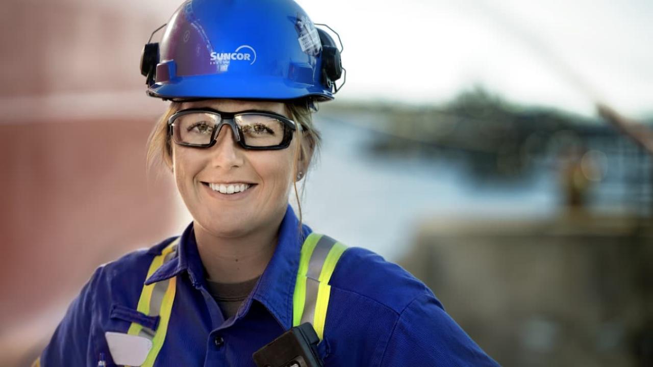 Person smiling while wearing work uniform