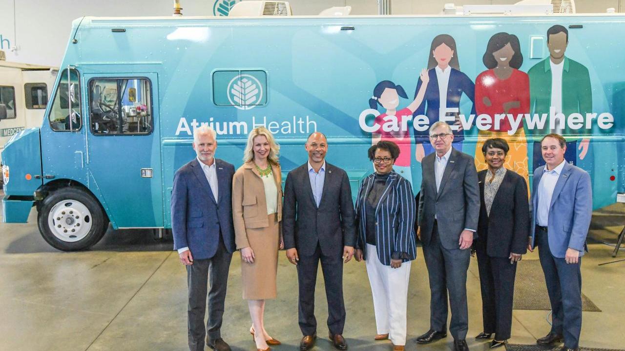 Truist and Atrium health leaders standing in front of Atrium Truck