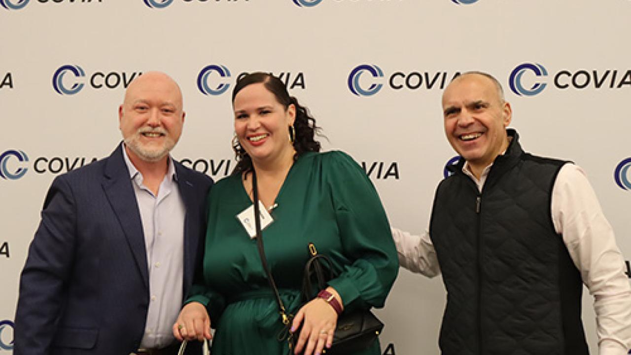 Three smiling people