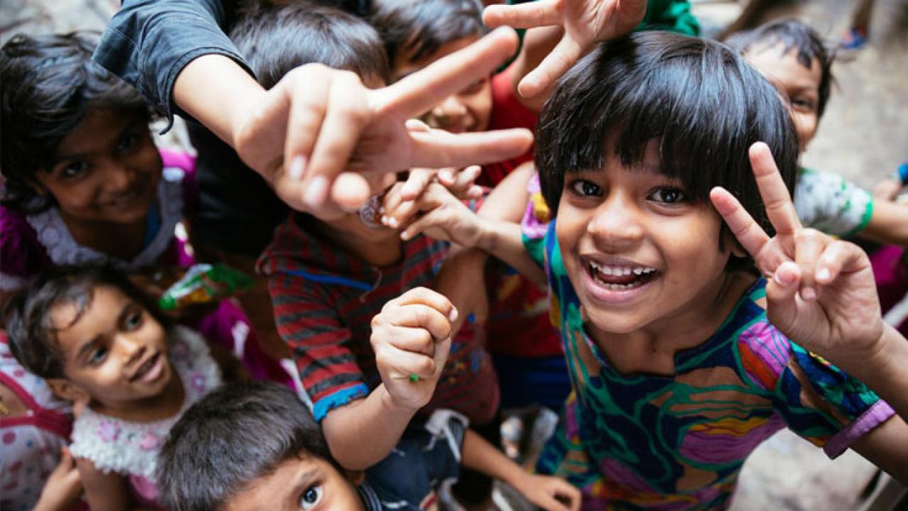 Children shown giving the V for victory sign.