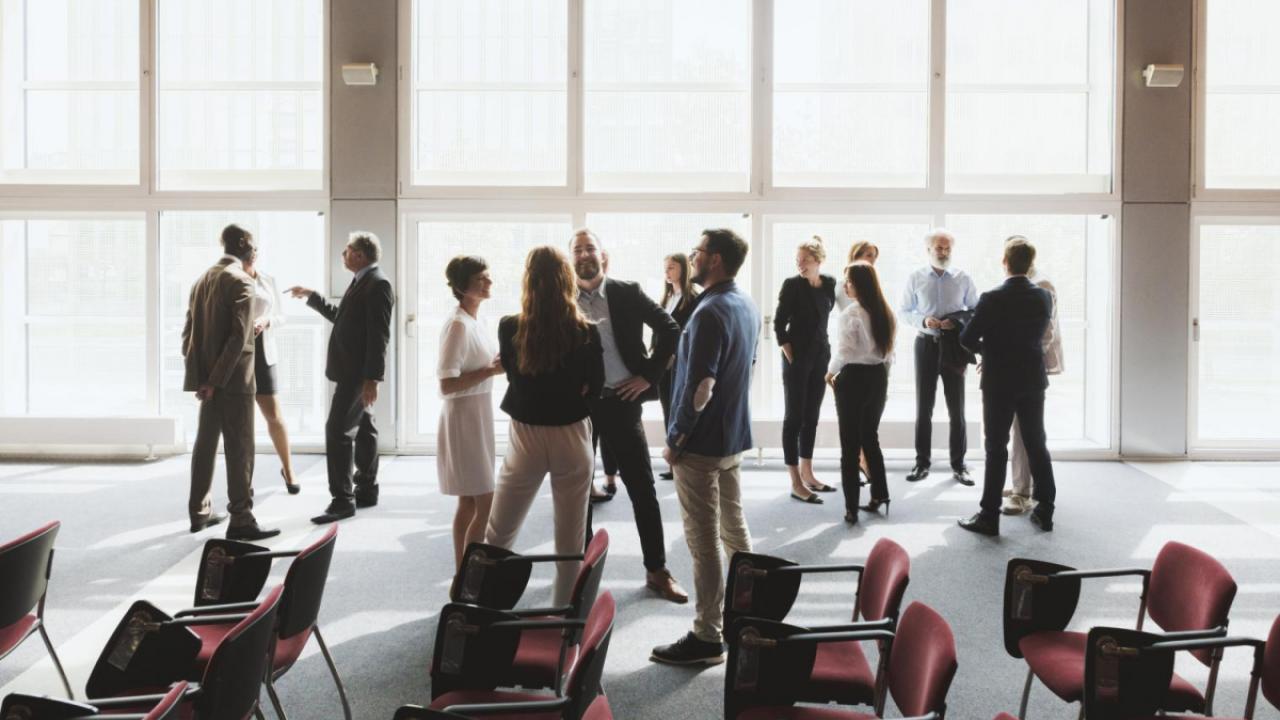 Group of conference attendees mingling