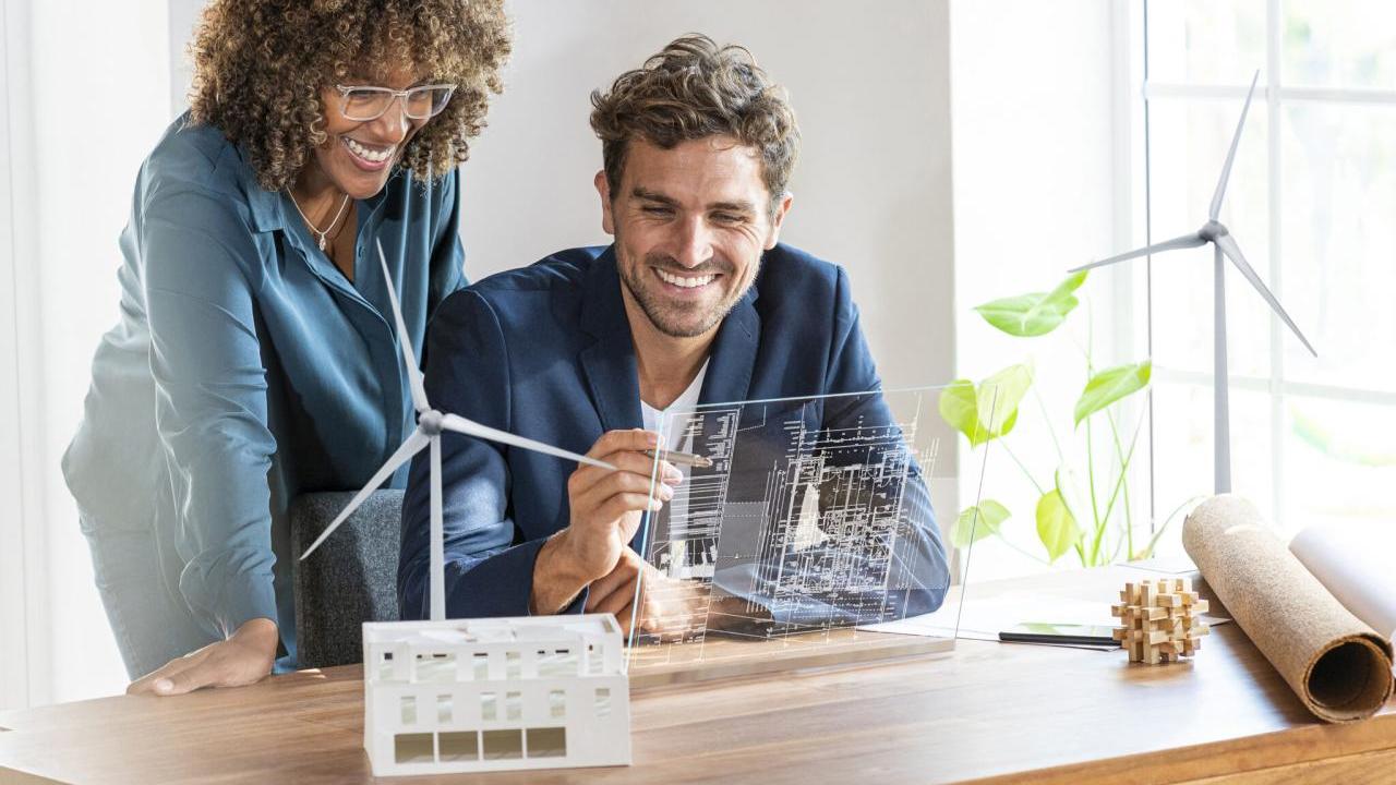 2 people looking at futuristic computer