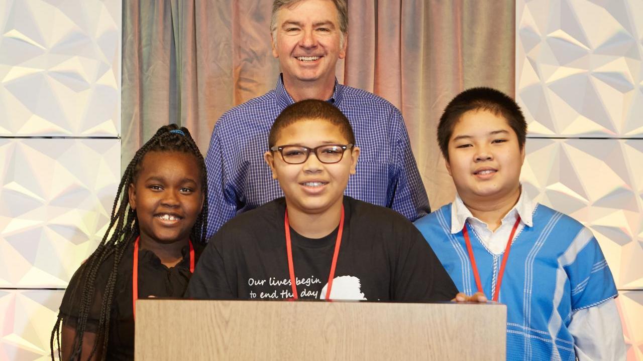 Jim Snee, chairman of the board, president, and chief executive officer of Hormel Foods with winners of the 12th annual Hormel Foods MLK essay contest that included: Ava Pigrum, Sacramento, Calif., Andre Smith, Minneapolis, Minn., and Michael Htoo, Willmar, Minn.