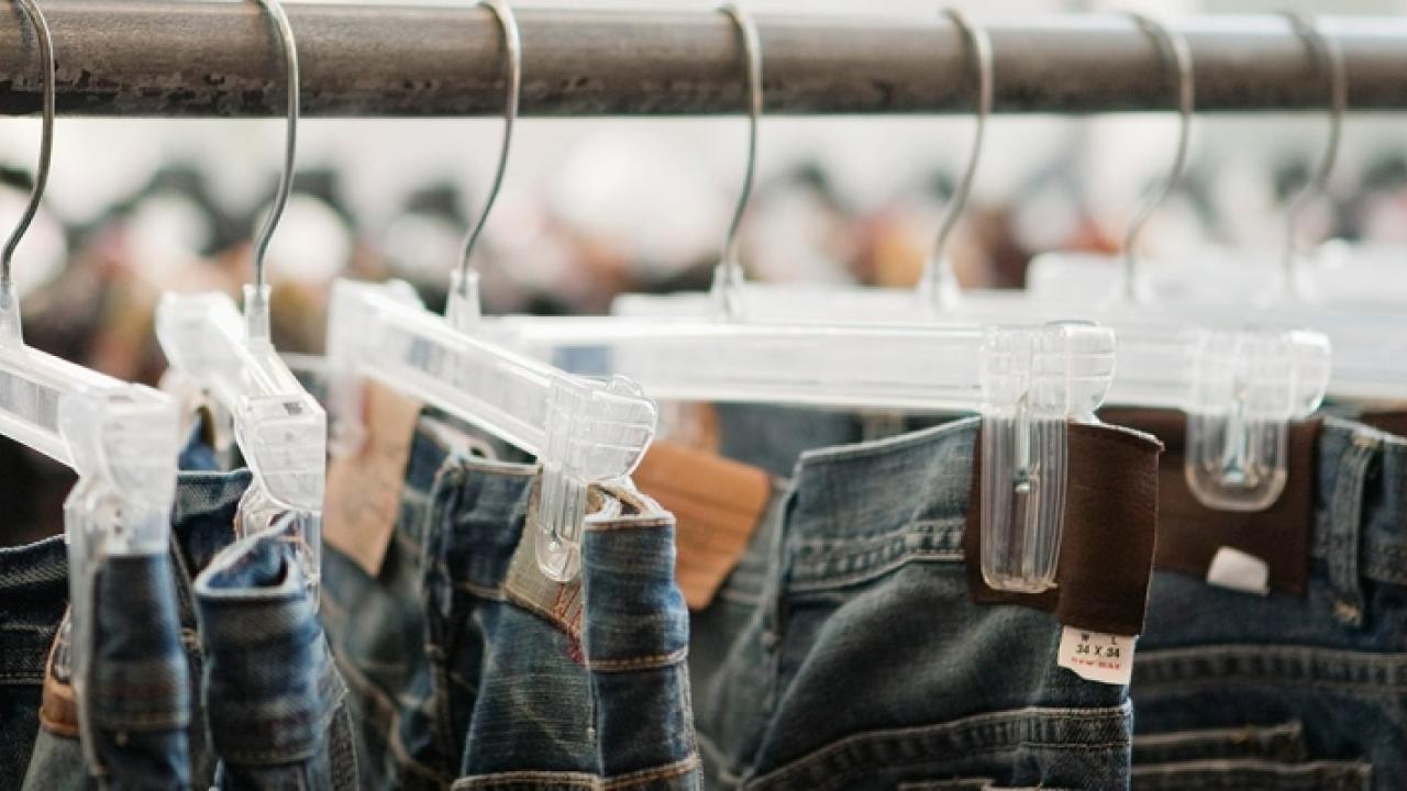 jeans hanging on a sales rack