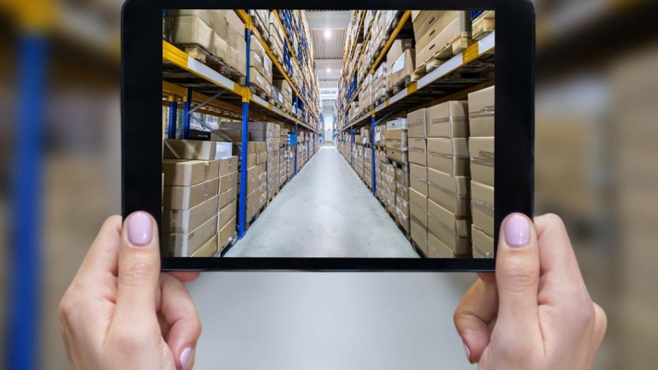 looking through a square at an aisle of boxes
