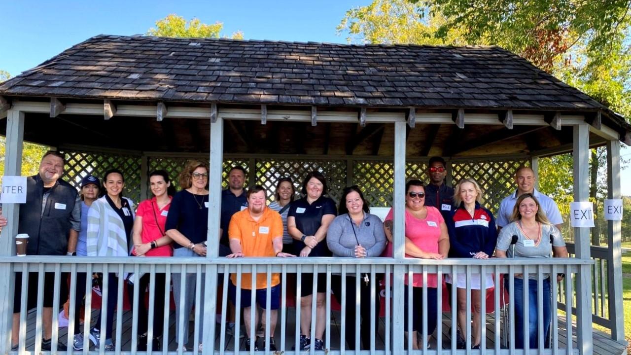 Rockwell’s Jason Sprunk (far left) and Rachel Schickowski (far right, front row) with several fellow members of the company’s ROKability employee resource group.