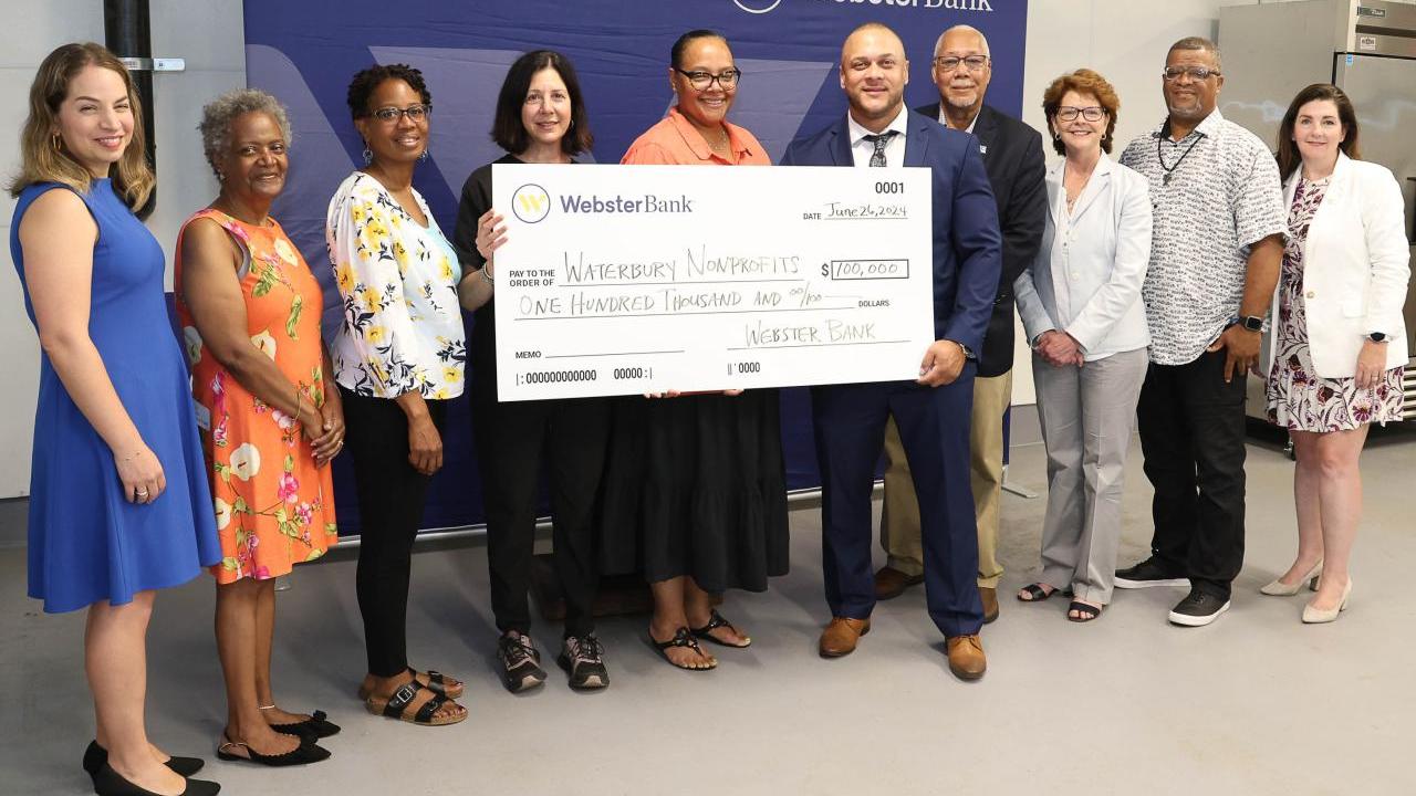 Group with an oversized check