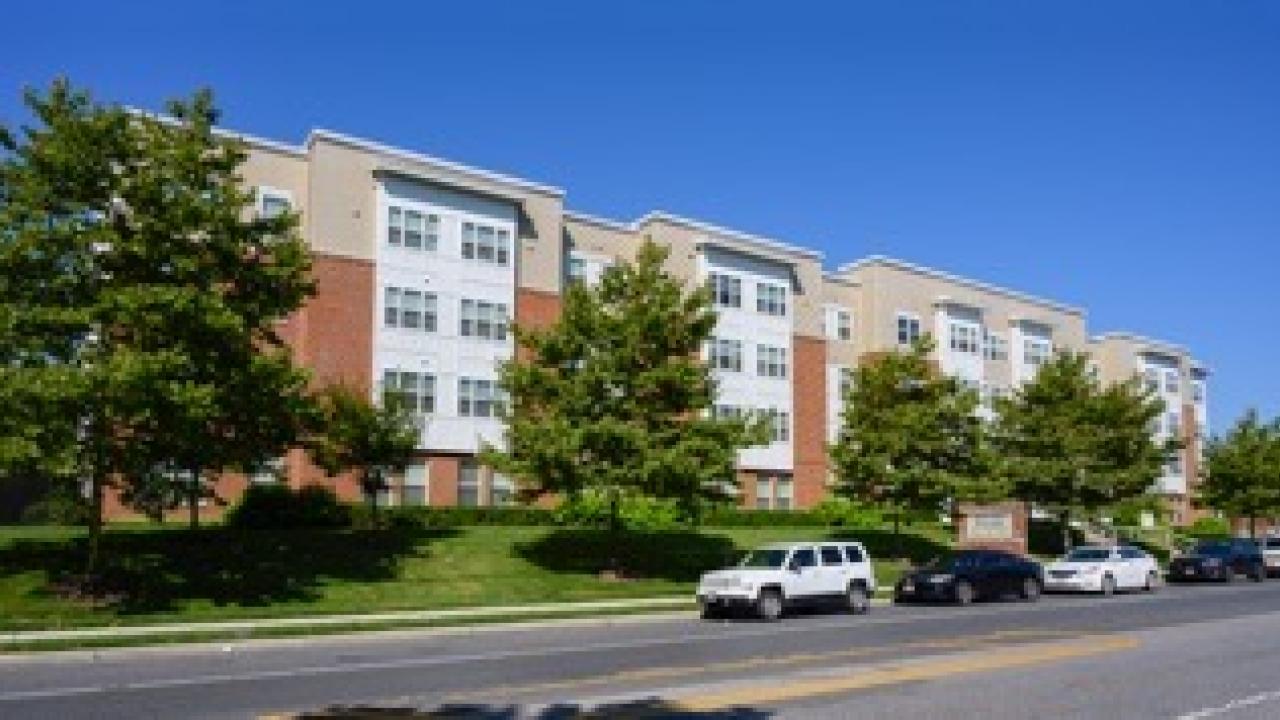 cars parked outside housing complex