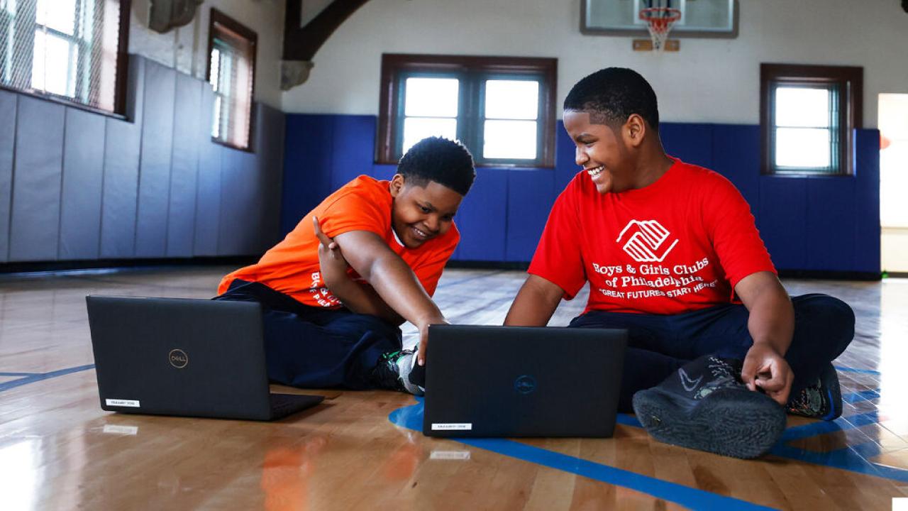 children sitting with computers