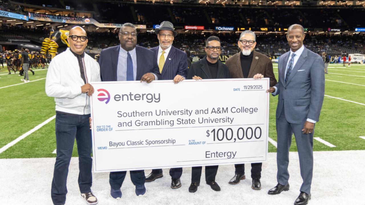 group holding up large check