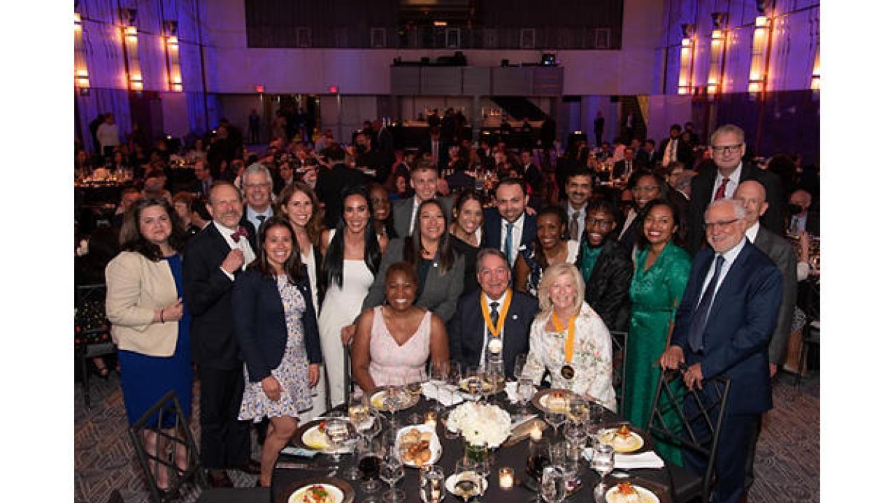 Steve Rusckowski with a group of people at a awards dinner