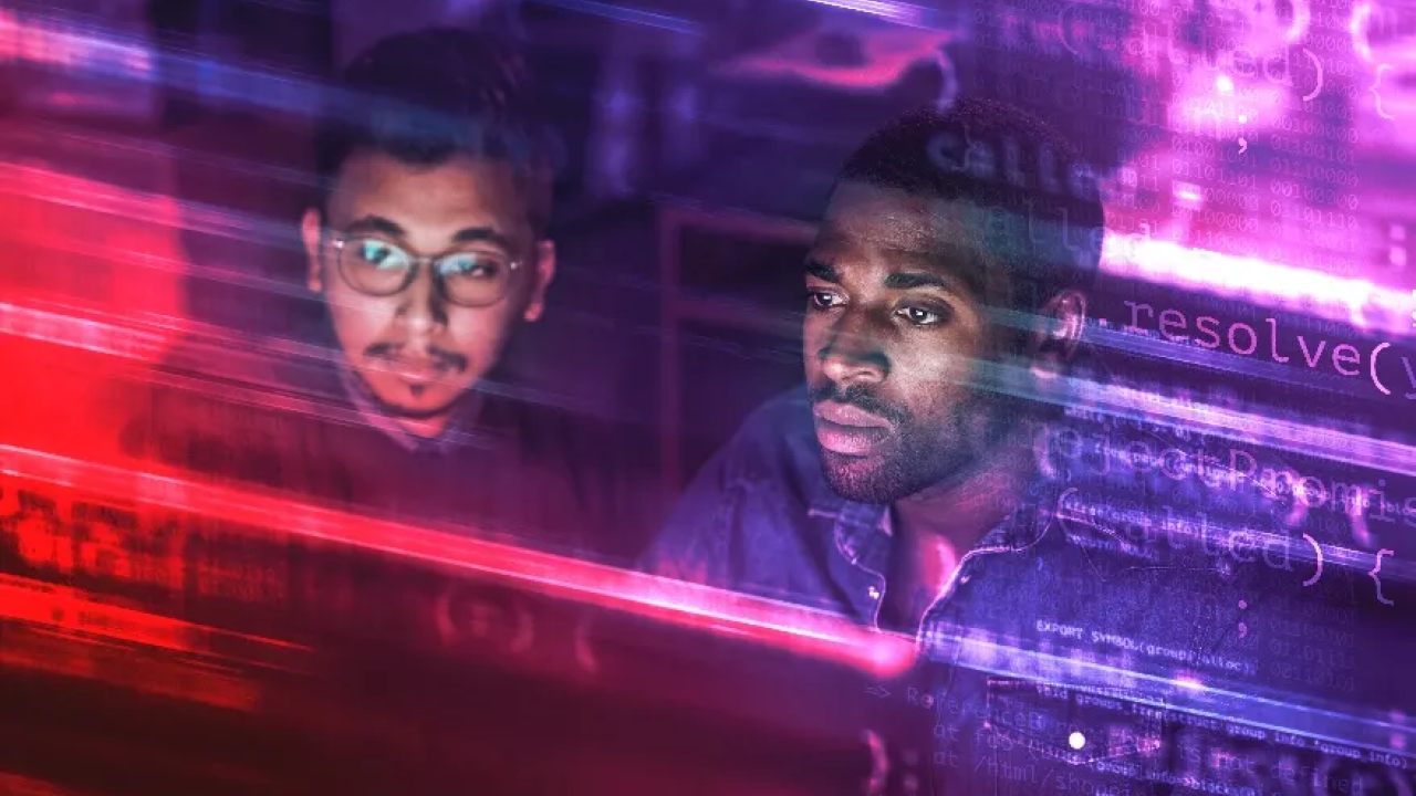 2 people looking at a computer screen
