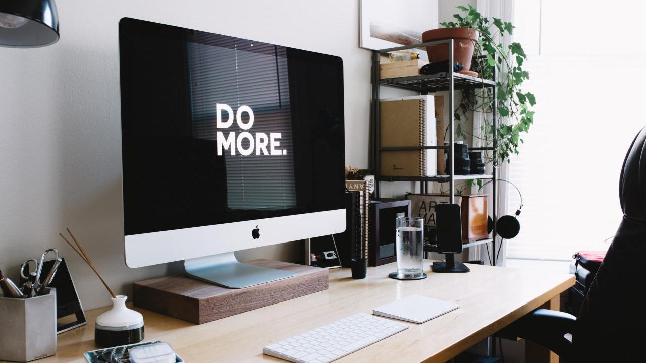 Computer screen reads: "Do More."