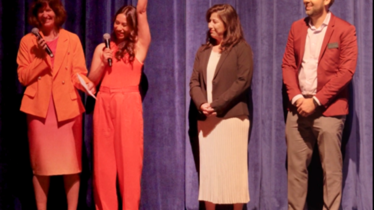 Members of the A Step Beyond leadership team react to receiving a 75for75 Sports Matter Grant