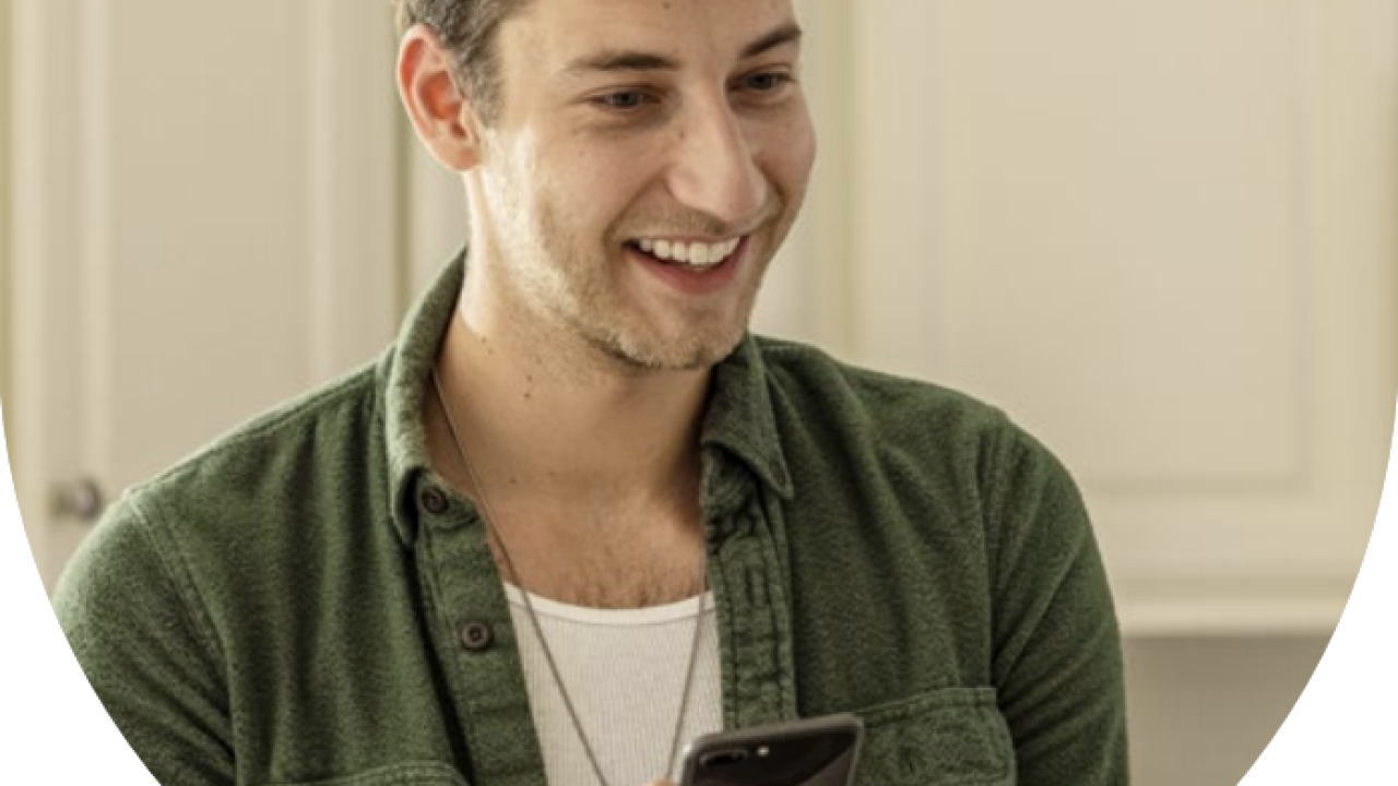 A person holding a mobile phone 