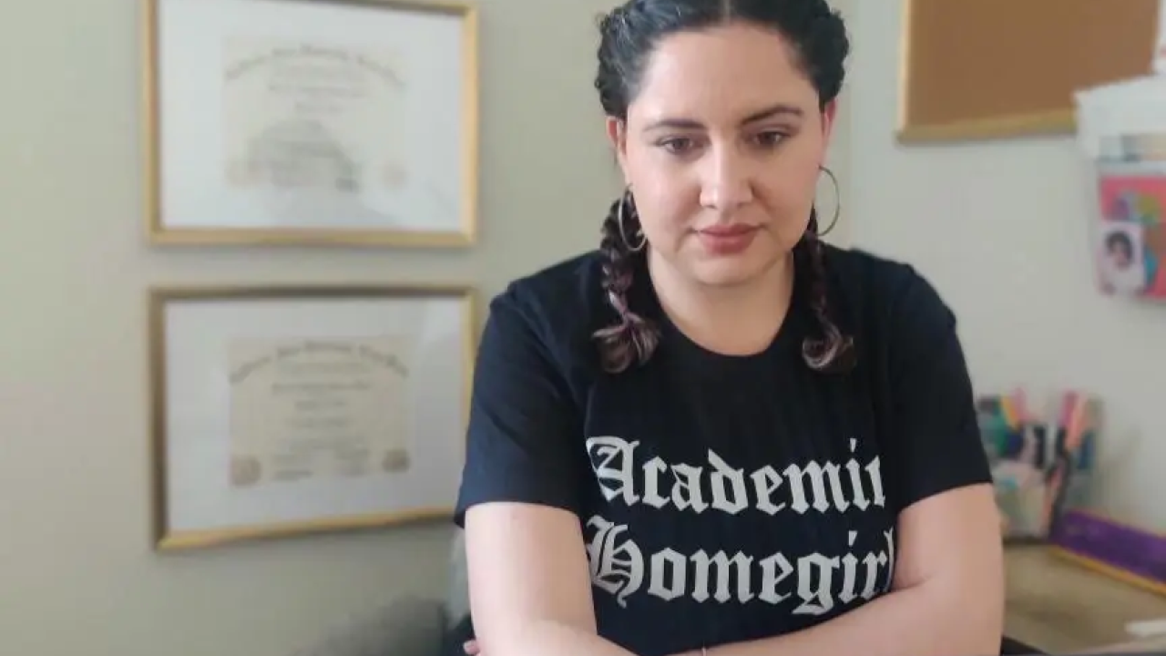Dr. Maricela Becerra, using a laptop