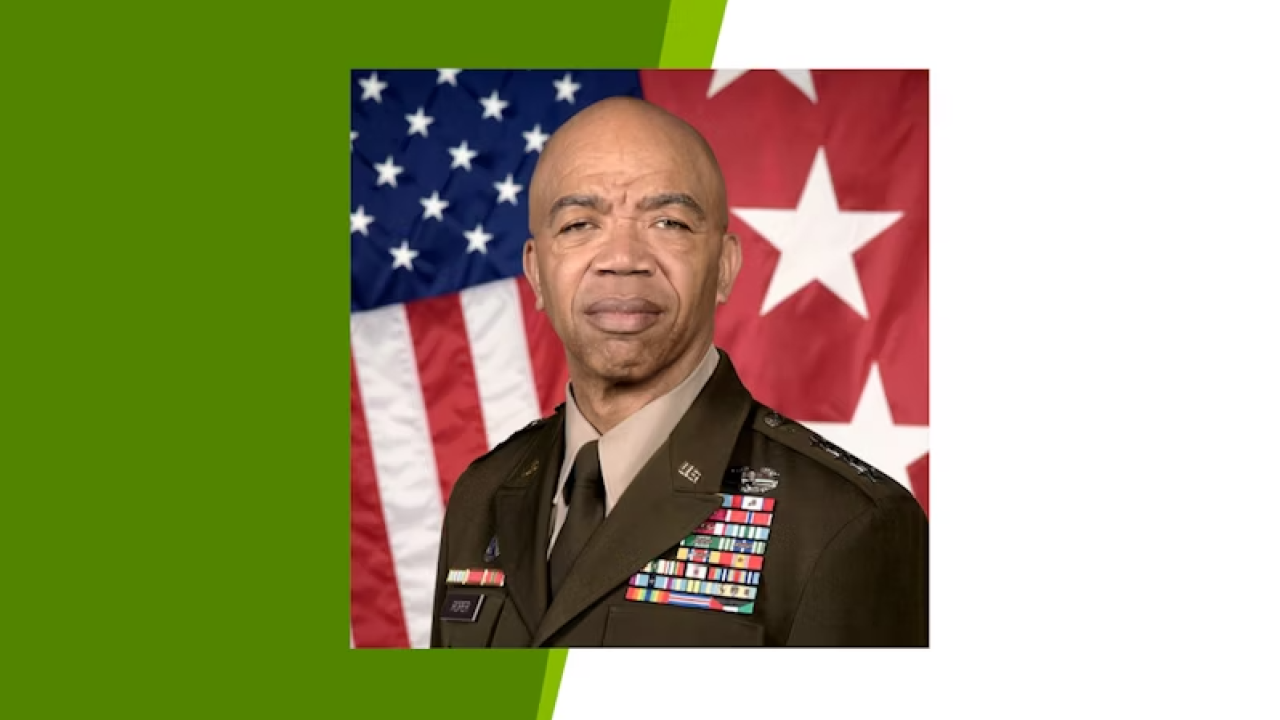 Headshot of Lieutenant General A. C. Roper with an American Flag