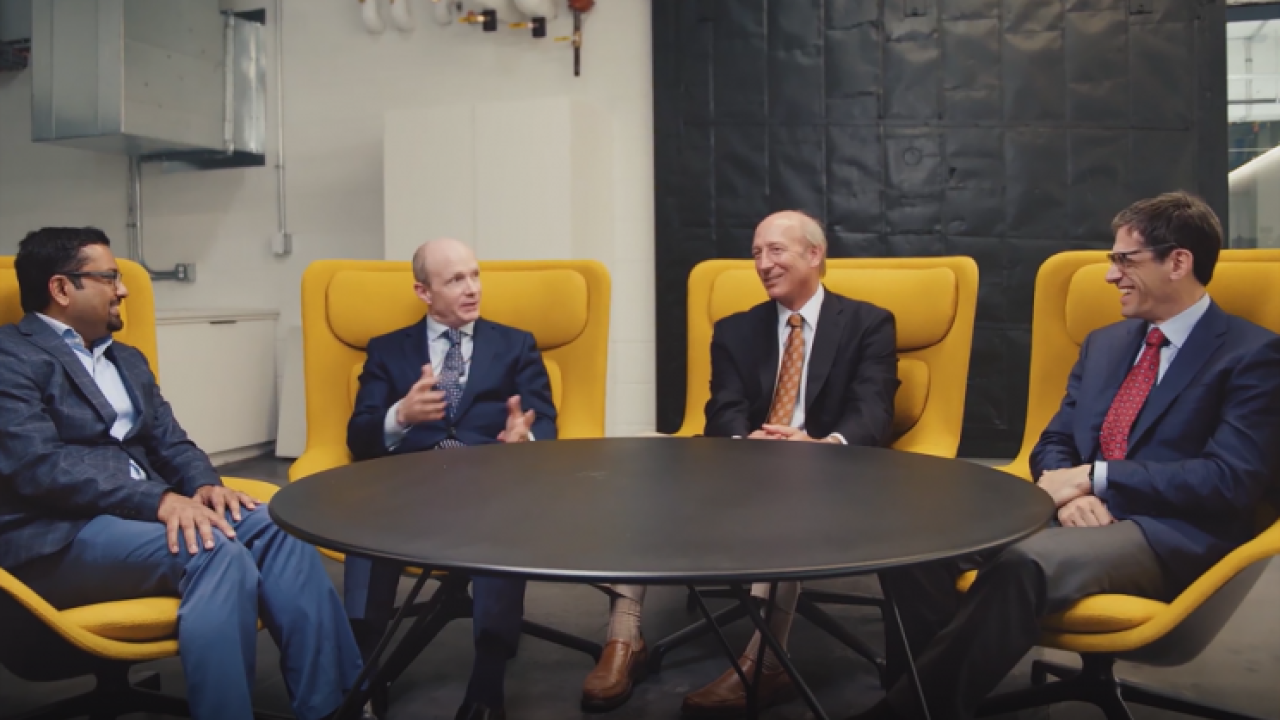 4 people meeting at a table