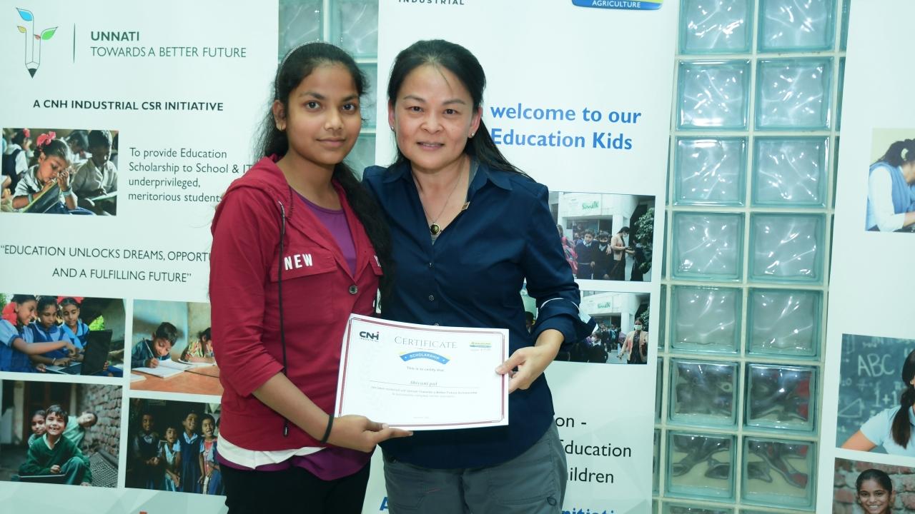 Two women with certificate. 