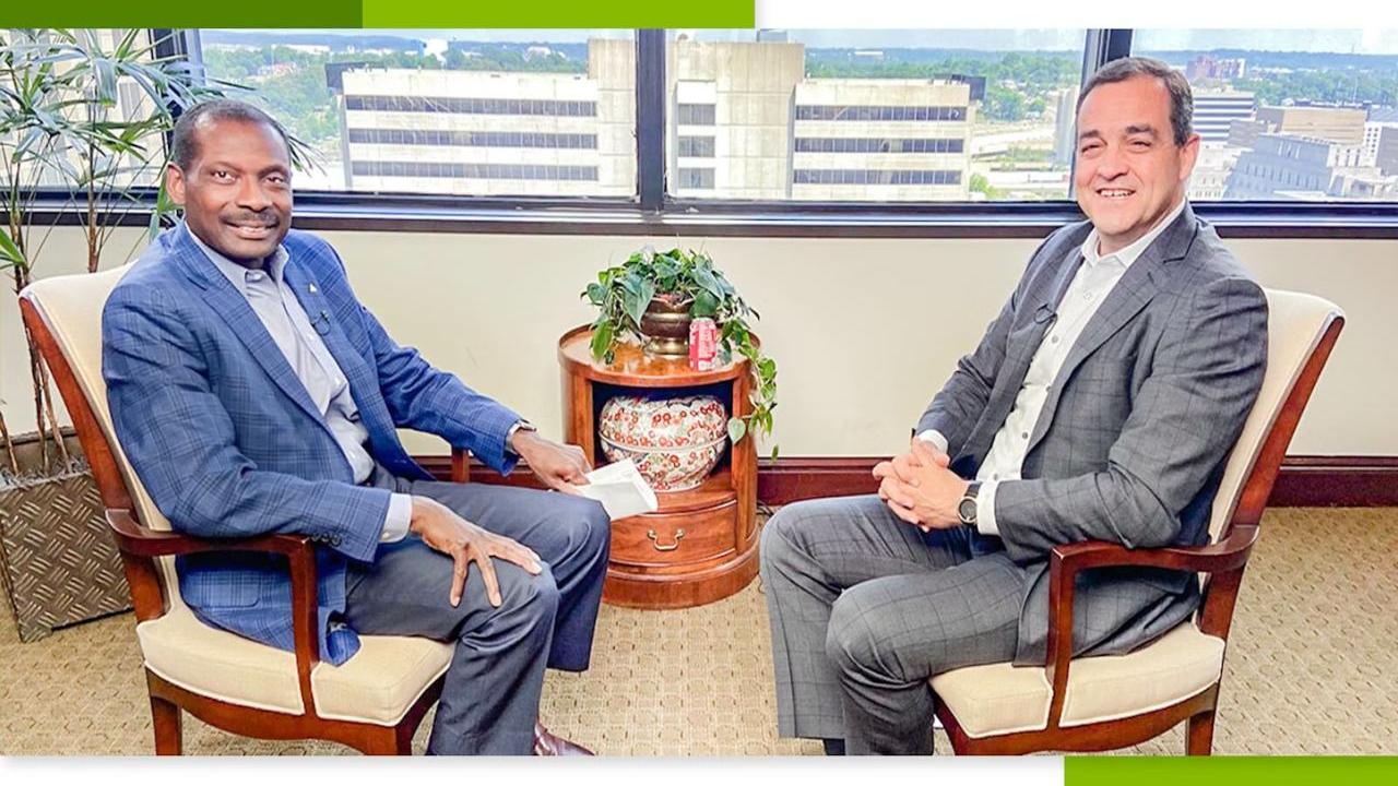 Leroy Abrahams and Mike Suco sat opposite each other