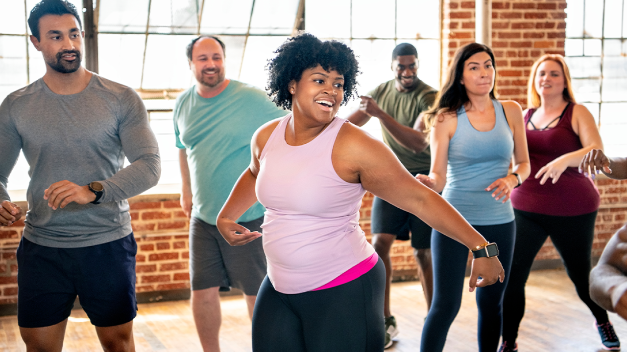 Group of people doing aerobic exercise.