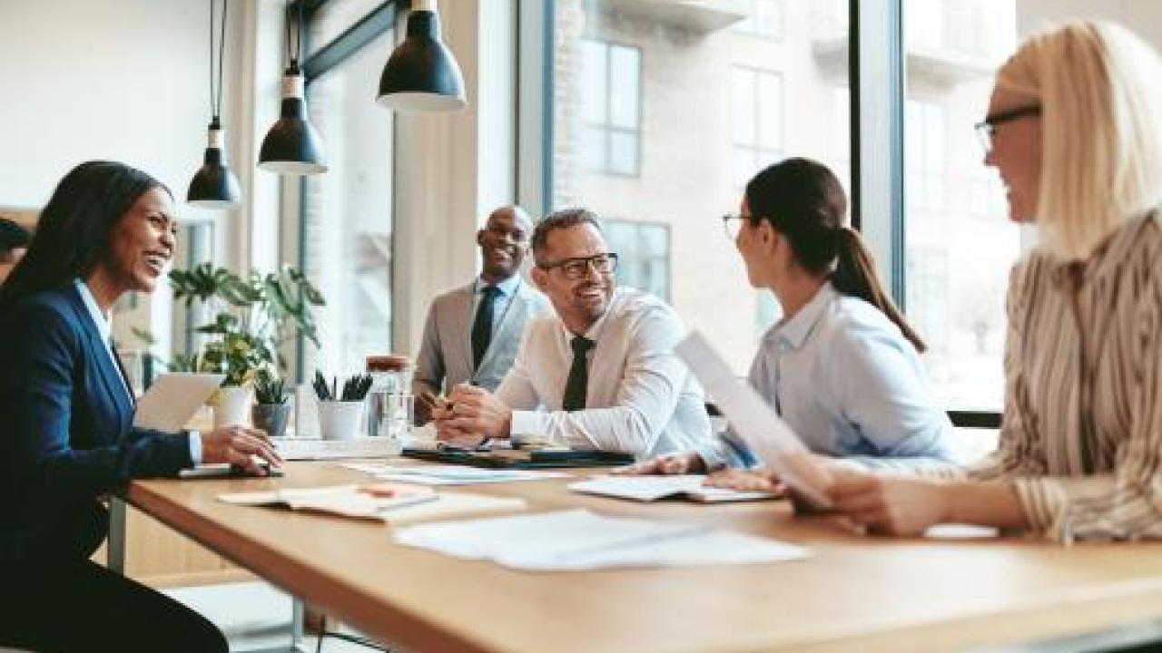 people sitting at a common workspace 