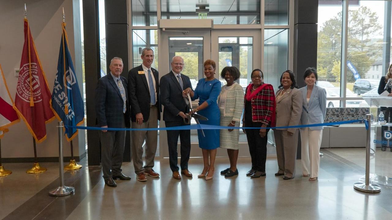 Group photo of the ribbon cutting