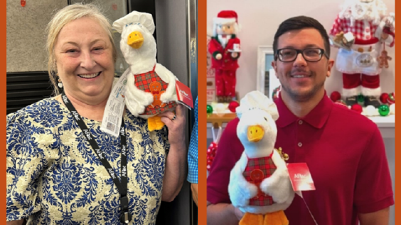 Aflac employees Judy Davis and Miguel Cubas shown with the Aflac Holiday Duck.