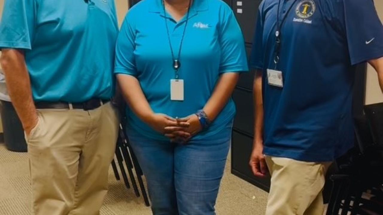 Aflac volunteers shown with representatives from the Chattahoochee Valley school district.