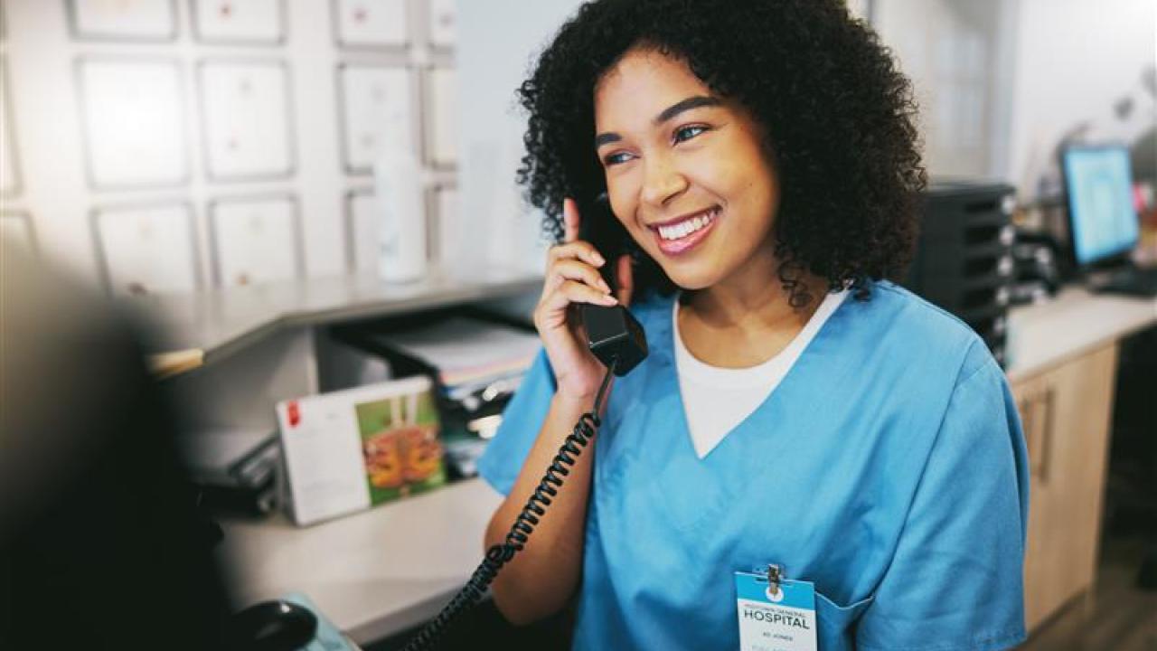 A medical professional taking a phone call.