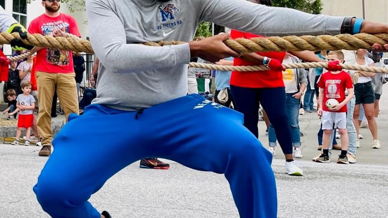 Marcus Jones pulling a firetruck.
